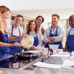 RemarkablePeople team action group cooking lesson